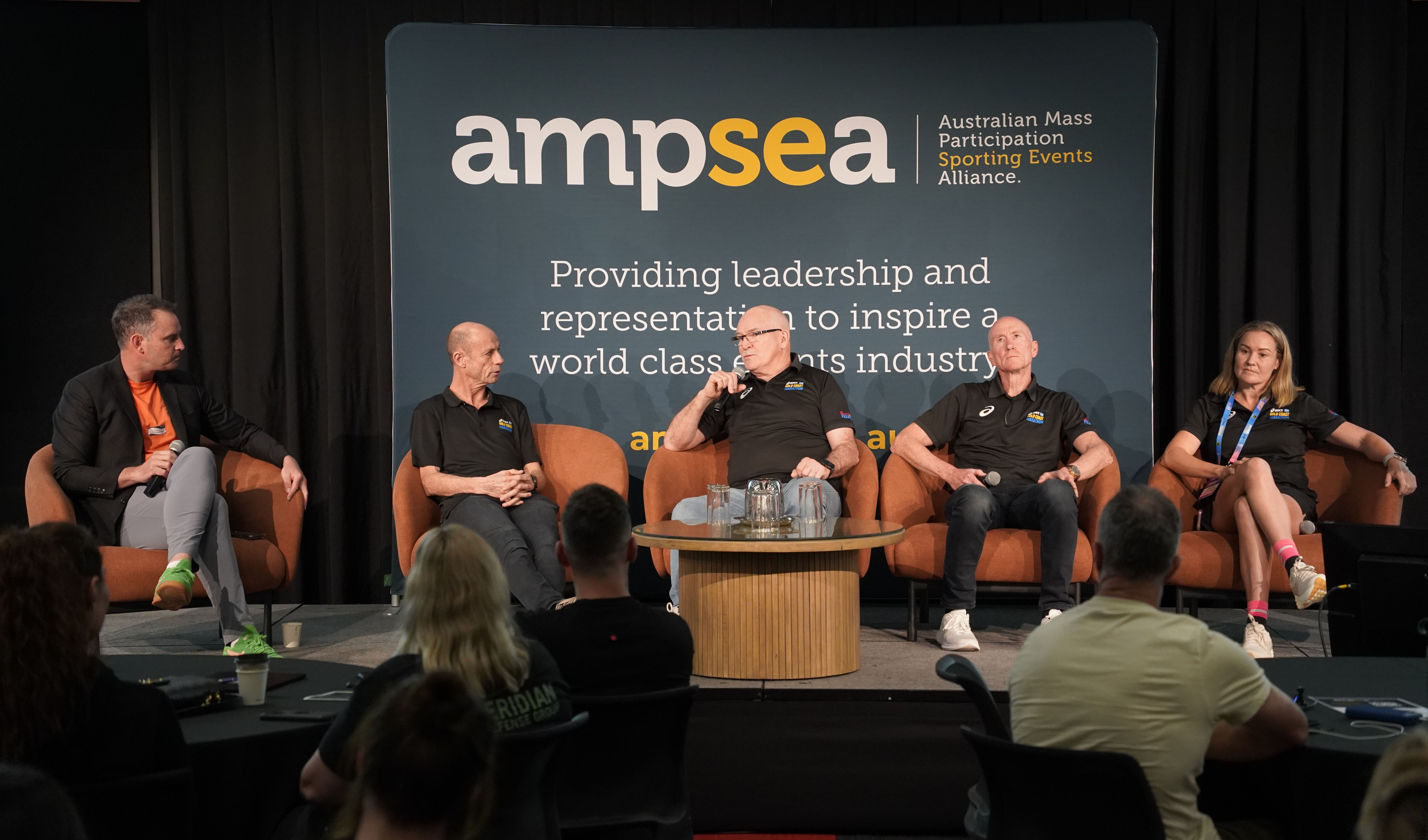 Legends panel discussion on stage at the AMPSEA Conference